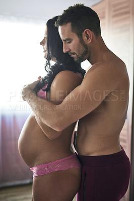 Buy stock photo Home, hug and pregnant with couple, stomach and wellness with parents, support and bonding together. Healthy, pregnancy and man with woman, embrace and relationship with marriage, happiness and tummy