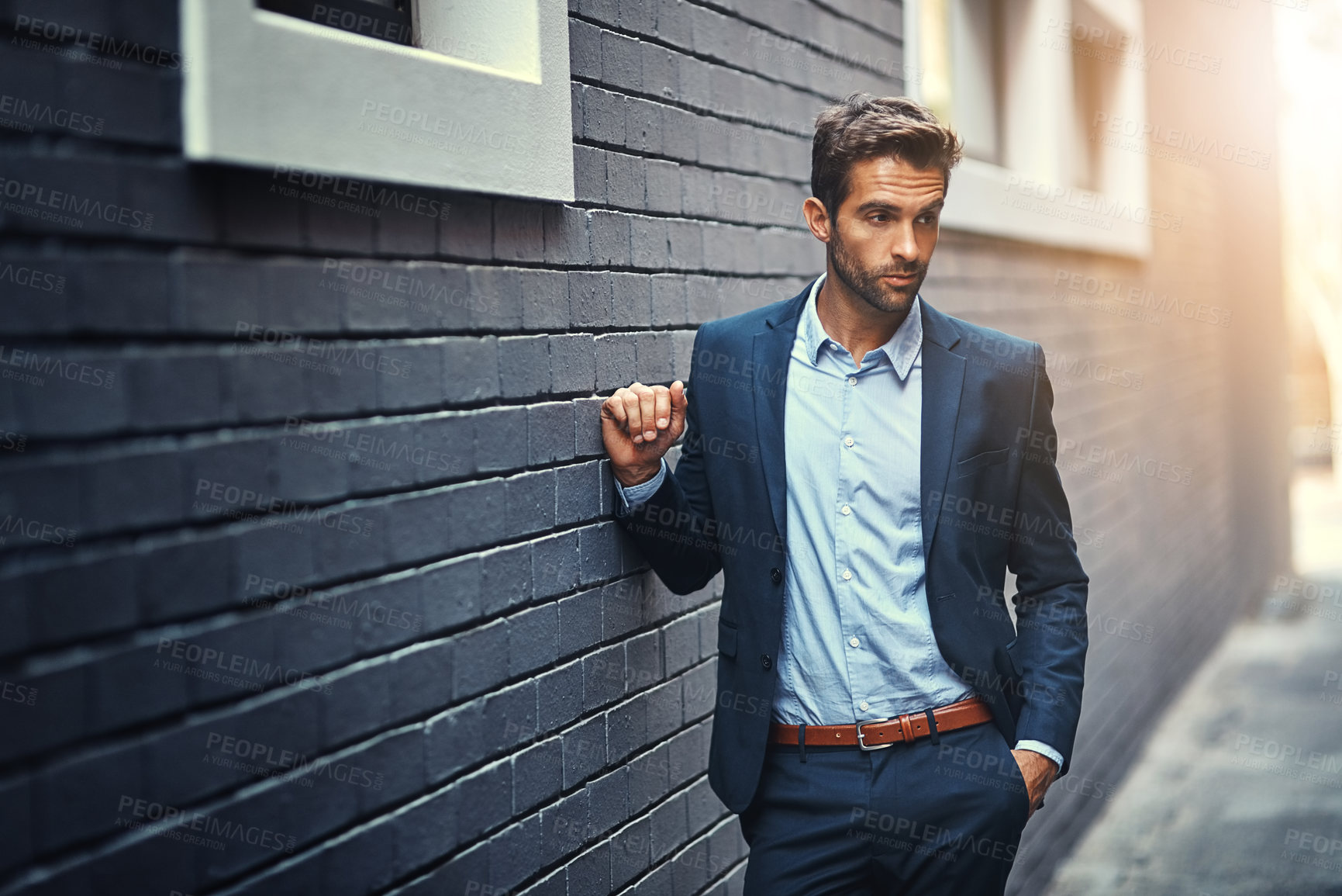 Buy stock photo Thinking, businessman and wonder in city by wall with corporate fashion, trendy and stylish suit. Male entrepreneur, professional and confident in street for commute to work or company and outdoor.