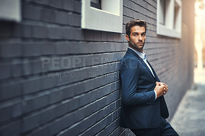 Buy stock photo Fashion, businessman and thinking in city by wall with corporate style, trendy and sophisticated suit. Male entrepreneur, professional and confident in street for travel, work or company and outdoor.