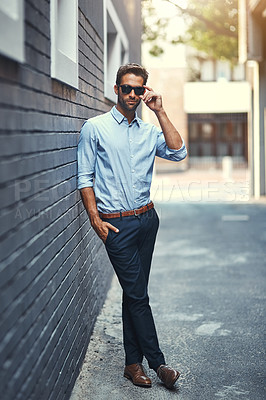 Buy stock photo Career, man and real estate in street for fashion in leaning on wall, style and trendy outdoor. Male person, pride and confidence in town for work, corporate or business as professional in London
