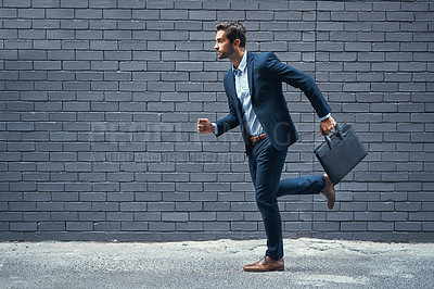 Buy stock photo Rush, man and suit in city for corporate career, professional business or company with briefcase. Young person, run and handsome with formal wear for organisation or hurry in urban brick wall mockup