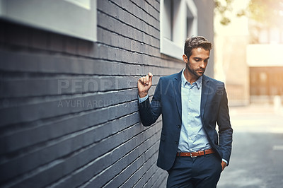 Buy stock photo Serious, businessman and thinking in city by wall for corporate fashion, trendy and stylish suit. Male entrepreneur, professional and confident in street for travel to work or company and outdoor.