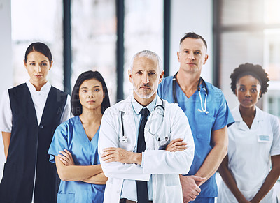 Buy stock photo Team, senior doctor and portrait of nurses and doctors in hospital, support and teamwork in healthcare. Health care, diversity and medicine, confident leader and group of medical employees together.