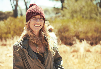 Buy stock photo Shot of young people hiking through a wilderness area