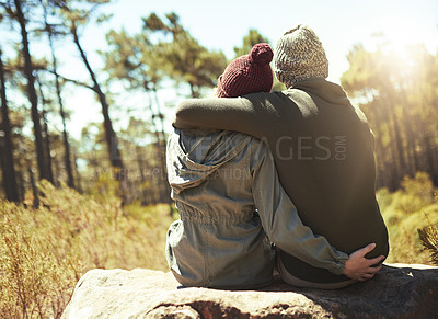 Buy stock photo Rearview shot of a couple taking a break while on a hiking trip
