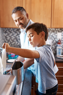 Buy stock photo Home, father and son washing dishes, family and help with development, cleaning and chores. Male parent, dad and son in the kitchen, teaching skills and growth with bonding, learning and cooperation