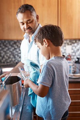 Buy stock photo Child, help and father washing dishes in kitchen together for learning housekeeping at home. Teaching, hygiene and dad with boy kid cleaning glasses with cloth for chores and bonding at house.