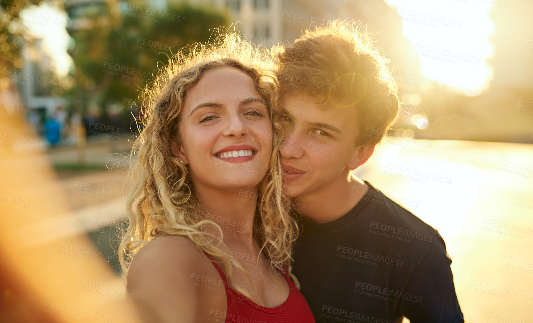 Buy stock photo Happy couple, portrait and selfie with sunshine in city for memory, picture or photography. Young man, woman or lovers with smile for outdoor bonding, moment or capture together in an urban town