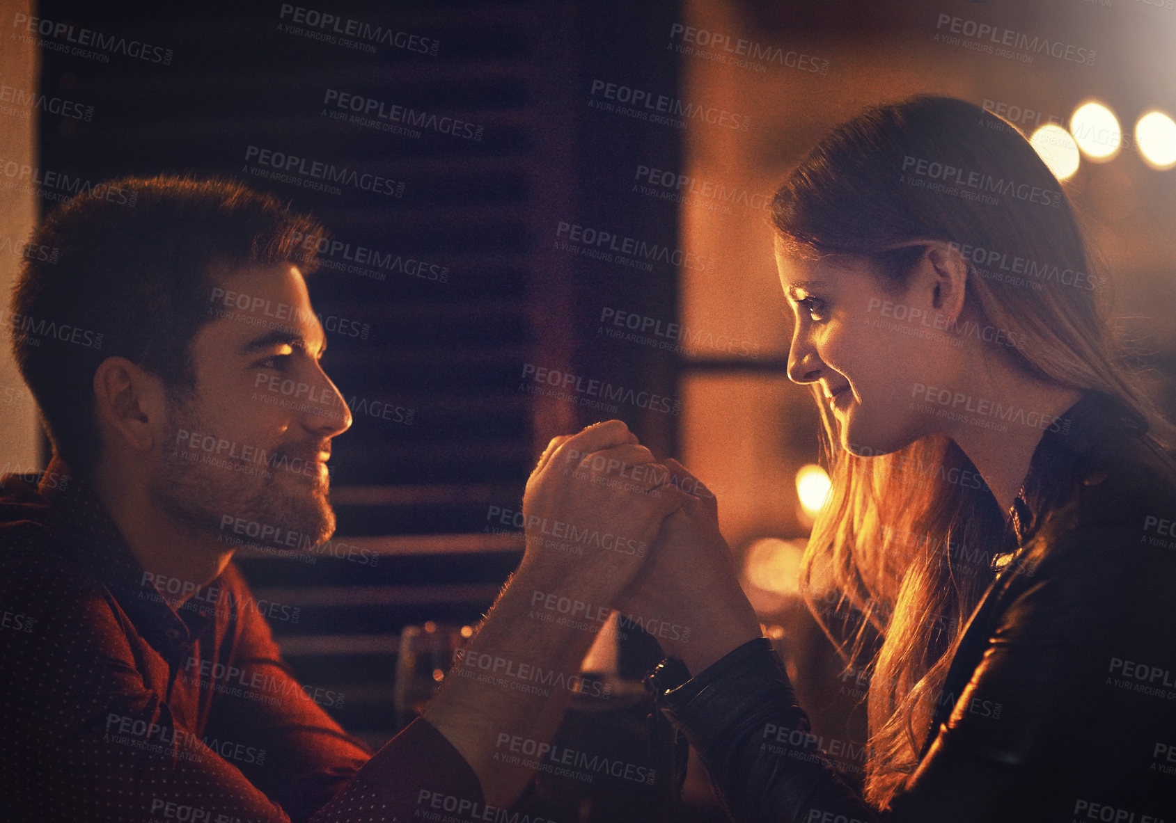 Buy stock photo Closeup shot of a loving couple holding hands on their date