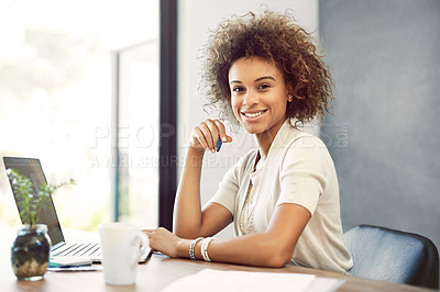 Buy stock photo Cropped portrait of an attractive young businesswoman working on her laptop at home