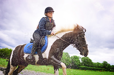 Buy stock photo Equestrian girl, splash and horse running, action and outdoor for sport hobby, fun and bonding for show. Teen jockey, animal and happy with countryside, farm and ranch riding together for care