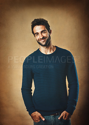 Buy stock photo Portrait, sweater and man in studio, fashion and warm in winter, confidence and smile for aesthetic. Proud, person and background of wall, model and cool with trend, stylish and jersey for clothes