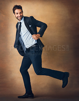 Buy stock photo Happy, businessman and fashion with running or rush for work goals and mission to promotion. Male entrepreneur or and employee with smile for chasing progress or reaching company target in studio