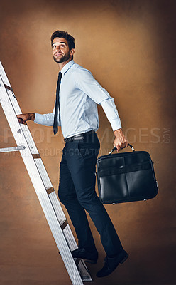 Buy stock photo Businessman, climbing and corporate ladder in studio for work opportunity, promotion and high salary. Confident, male person and entrepreneur with suitcase for trip to skill, responsibility and goals