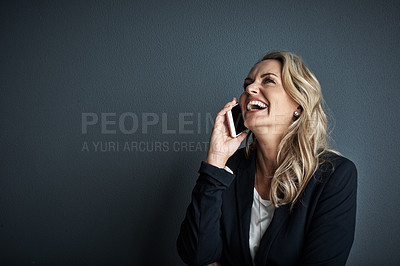 Buy stock photo Studio shot of a mature businesswoman talking on a cellphone against a grey background