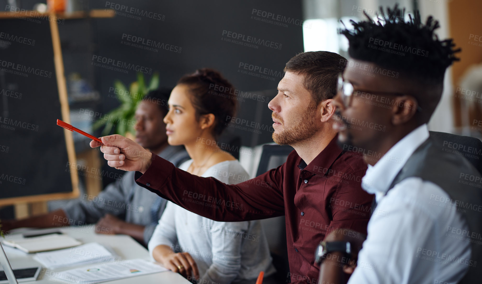 Buy stock photo Shot of a panel of businesspeople giving feedback during a presentation in an office