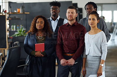Buy stock photo Shot of a group of businesspeople standing together in an office