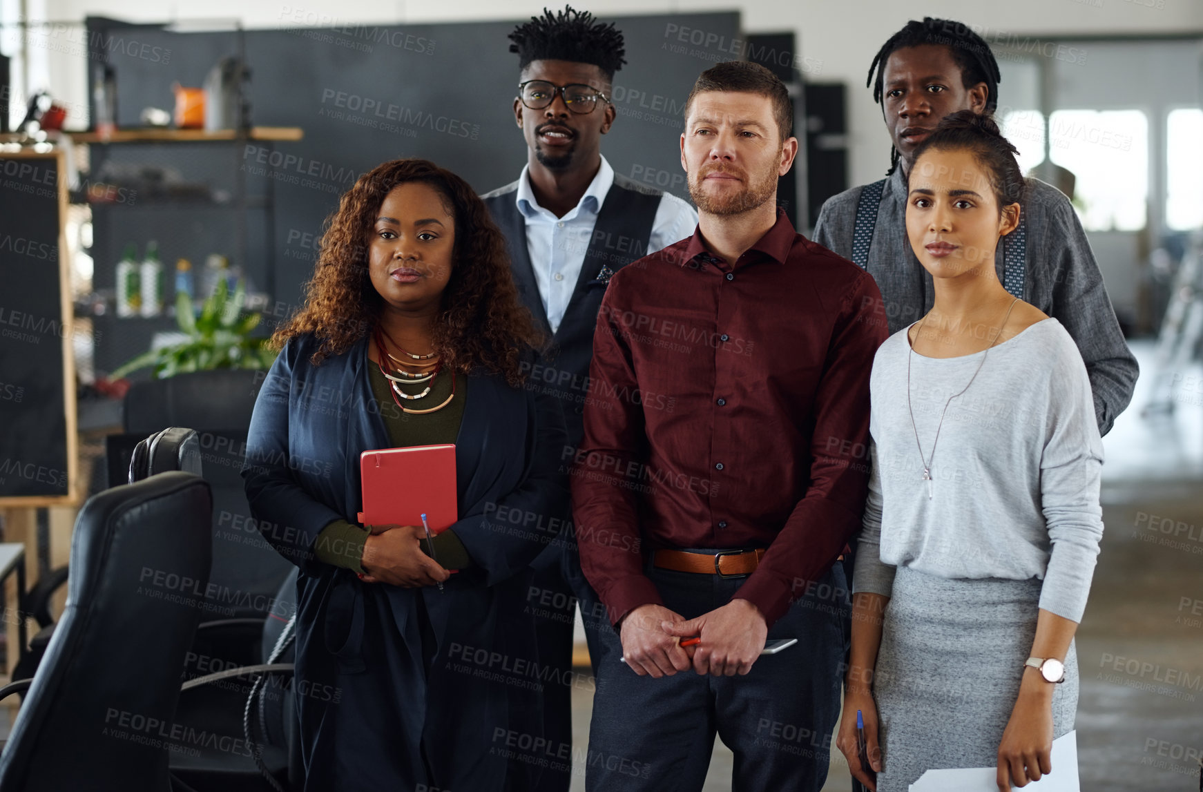 Buy stock photo Shot of a group of businesspeople standing together in an office