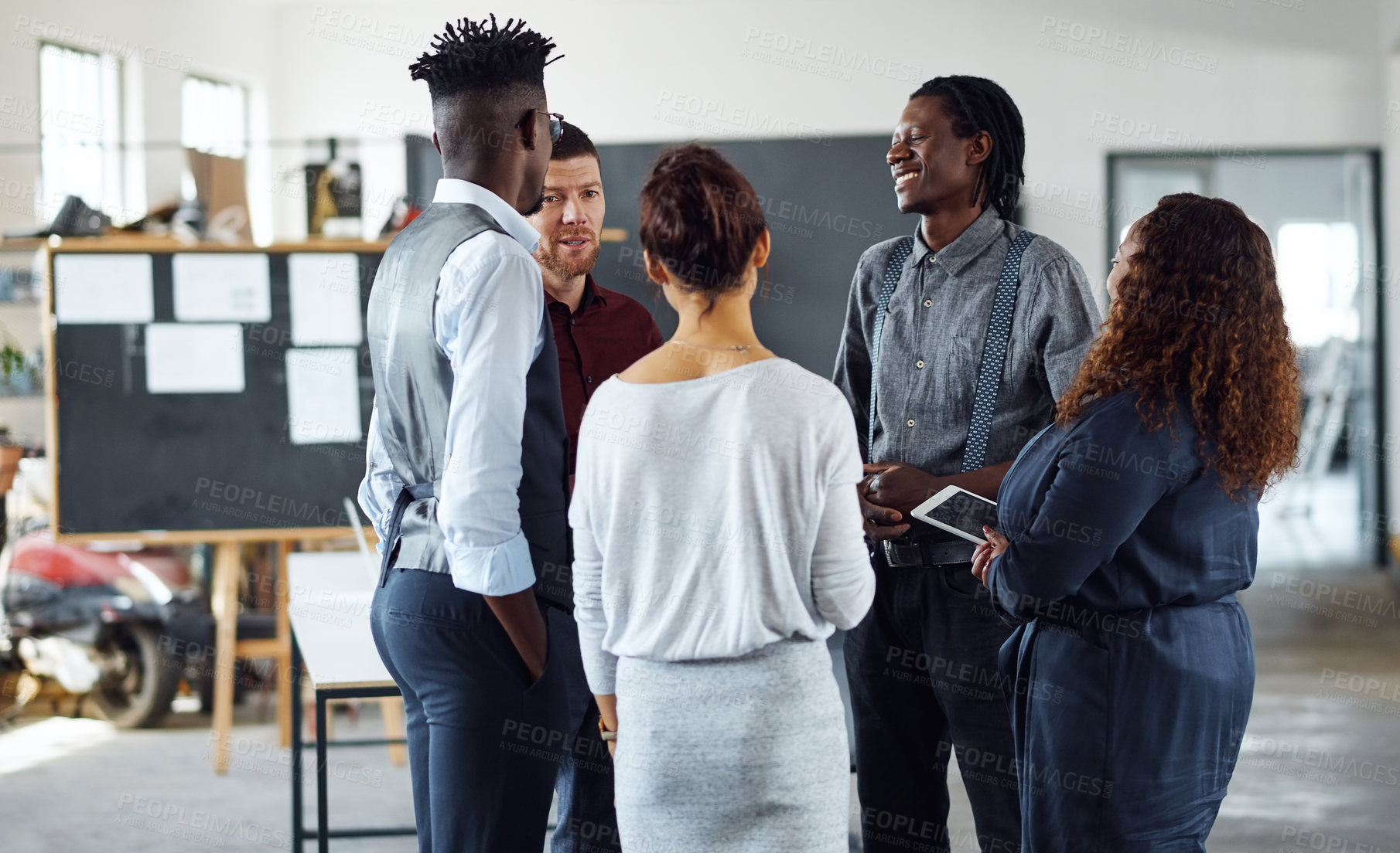 Buy stock photo Shot of a group of businesspeople having a discussion in an office