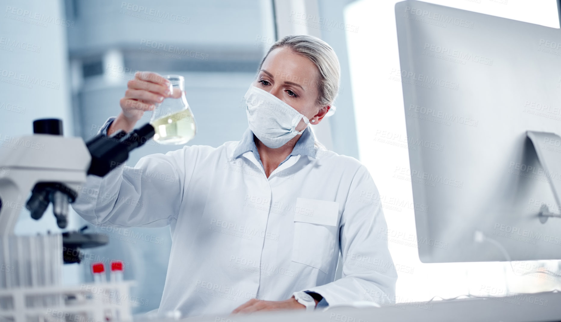 Buy stock photo Shot of a mature scientist working in her lab