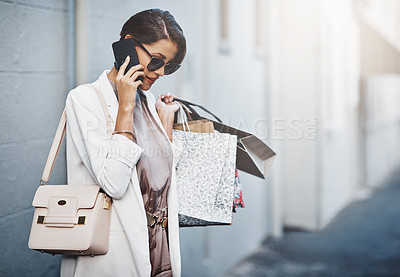 Buy stock photo Phone call, shopping bag and woman in city for communication, discount or promotion of fashion. News, gift offer and customer or person with clothes sale, wealth and ecommerce or product review chat