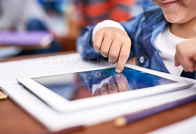 Buy stock photo Cropped shot of an unrecognizable elementary school child using a tablet in class