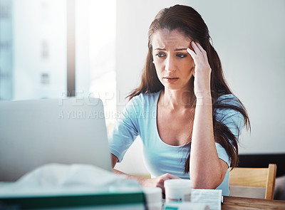 Buy stock photo Stress, headache and woman doing research on a laptop for her sickness, illness or disease. Burnout, allergies and female person with a migraine in pain on a telehealth call on a computer in her home
