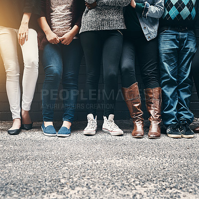 Buy stock photo Cropped shot of a group of unrecognizable people standing together