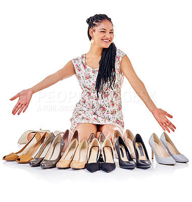 Buy stock photo Shot of a young woman sitting with her collection of high heels