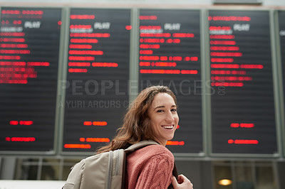 Buy stock photo Woman, portrait and airport with flight schedule on board for info display, smile and immigration. Person, backpack and international travel with digital time table on screen, location and arrival