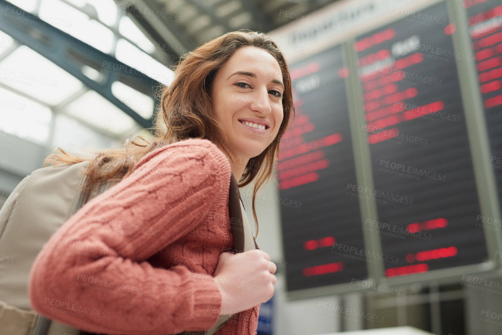 Buy stock photo Woman, portrait and airport with flight information on board for display, smile or immigration. Person, backpack and happy on international travel by digital timetable on screen, location or schedule