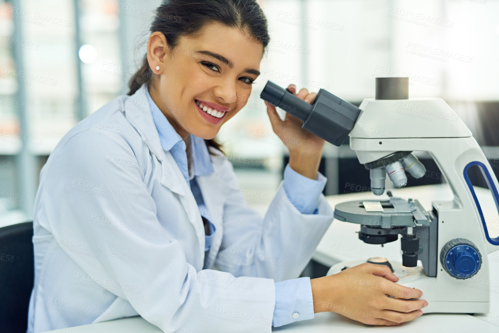 Buy stock photo Scientist, portrait and smile of woman with microscope in laboratory for medical research. Face, science and female doctor with lens equipment for sample analysis, particle test and lab experiment.