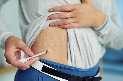 Buy stock photo Closeup shot of an unidentifiable businesswoman injecting her stomach