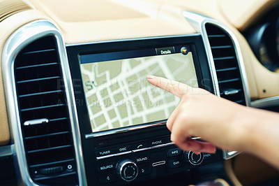 Buy stock photo Shot of an unrecognizable woman using a gps in a car