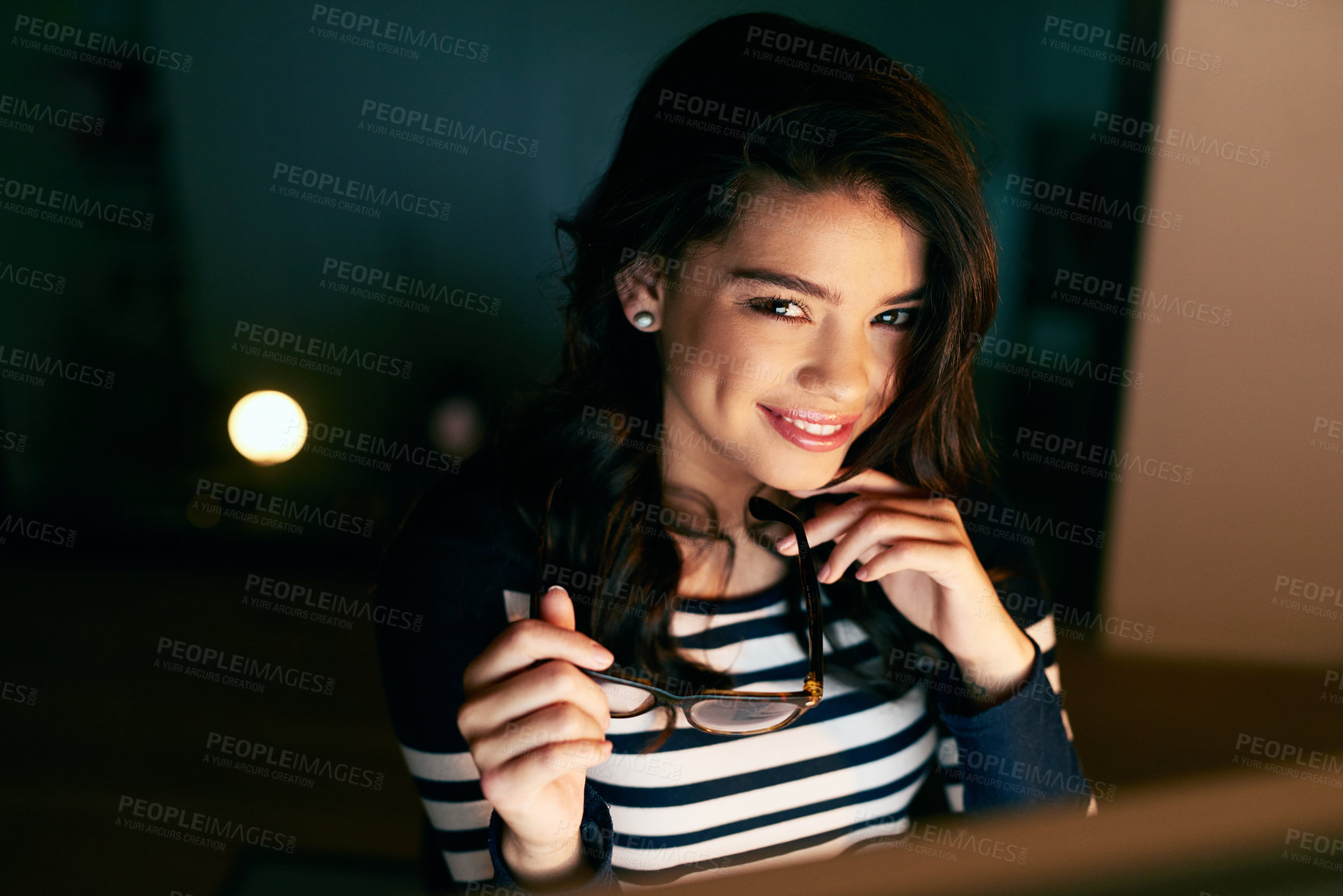 Buy stock photo Smile, night and portrait of woman in office with computer, glasses and confident attitude. Pride, happy and professional creative web designer with technology, research and overtime for deadline