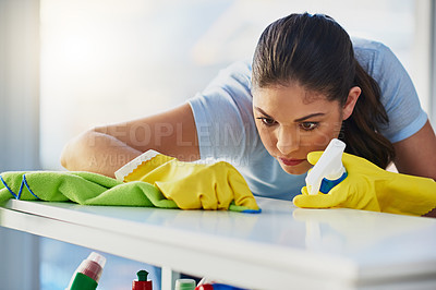 Buy stock photo Shot of a woman doing her daily chores at home 