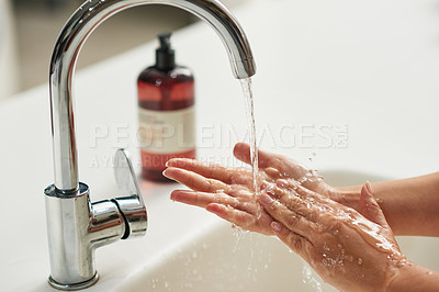 Buy stock photo Cleaning, disinfection and washing hands in bathroom for skincare, self care or hygiene with tap water. Safety, soap and healthy person at sink for liquid protection against bacteria or germs