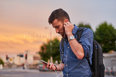 Buy stock photo Man, earphones and smartphone in city for walking, social media and communication with music or backpack. Artist, musician and streaming song for travel, podcast and creative inspiration with mobile