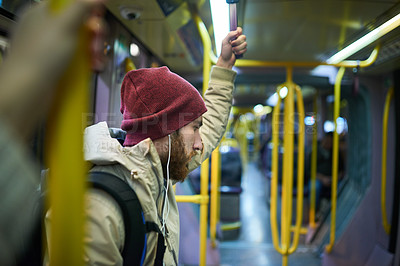 Buy stock photo Man, earphones and listening to music on bus journey, travel and passenger on public transport. Male person, streaming and commute in metro vehicle, New York traveler and train ride motor service