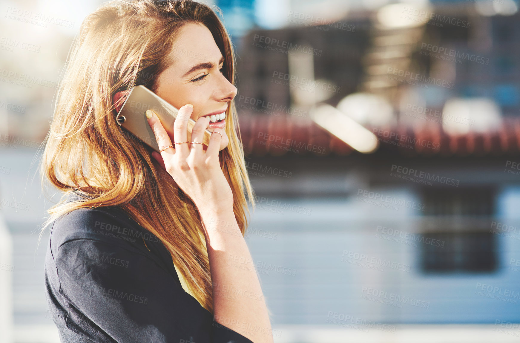 Buy stock photo Phone call, profile and happy woman in street for break, conversation and talking with smile. Funny story, laughing or female person in city for outdoor travel, gossip news or communication in Spain