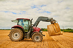 Stacking bales of hay