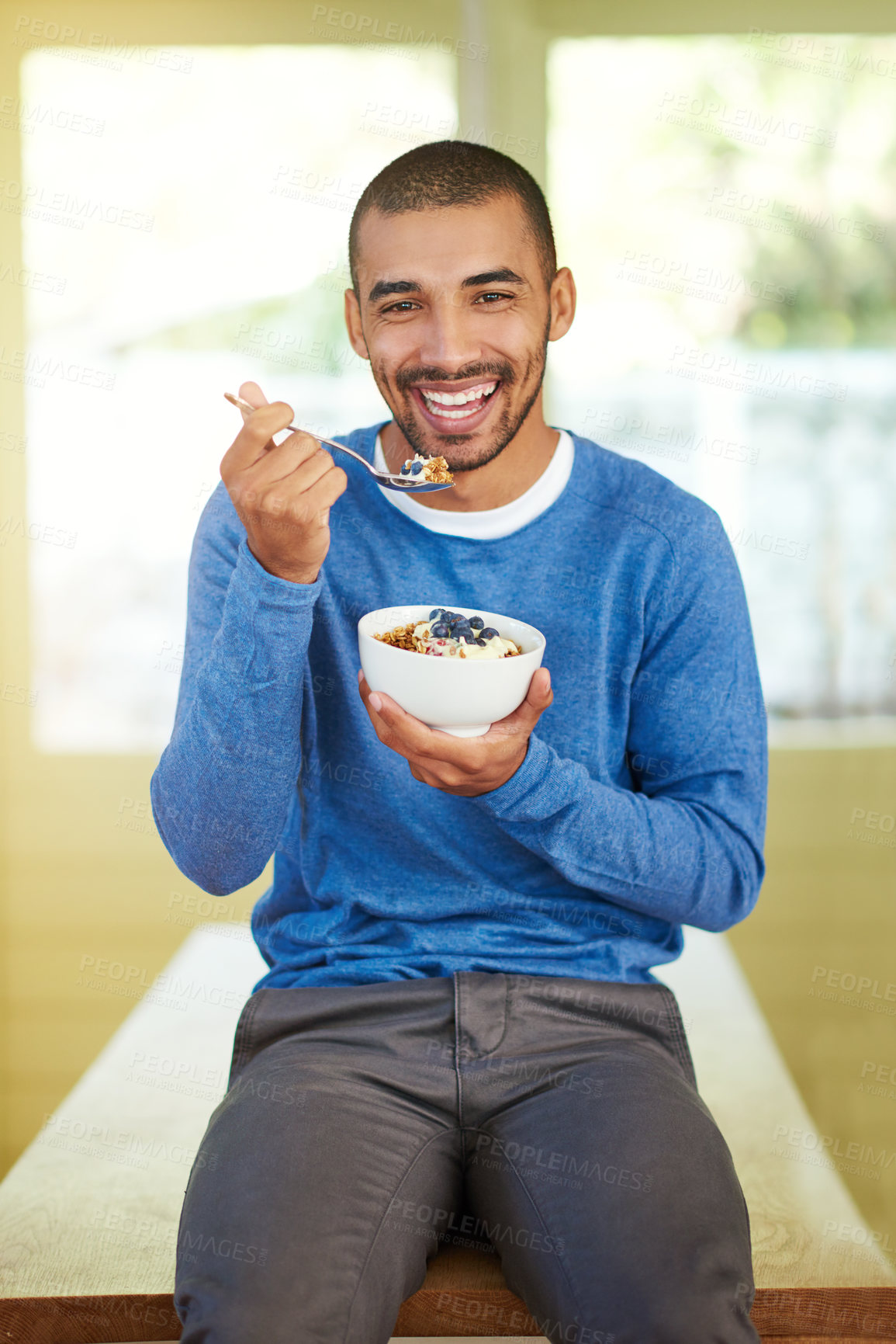 Buy stock photo Man, portrait and eating muesli breakfast in kitchen or health nutrition in morning, fruit or yogurt. Male person, face and bowl as lose weight diet or vitamin benefits as antioxidants, fibre or home