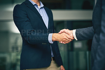 Buy stock photo Closeup of businesswomen shaking hands during a meeting in an office. Colleagues finalizing a successful promotion, deal and merger. Coworkers greet, collaborate and negotiate during job interview