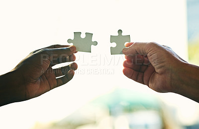 Buy stock photo Unity, synergy and teamwork with a puzzle assembly to find the perfect match or business solution. Employees put jigsaw pieces together for creative thinking team building activity.