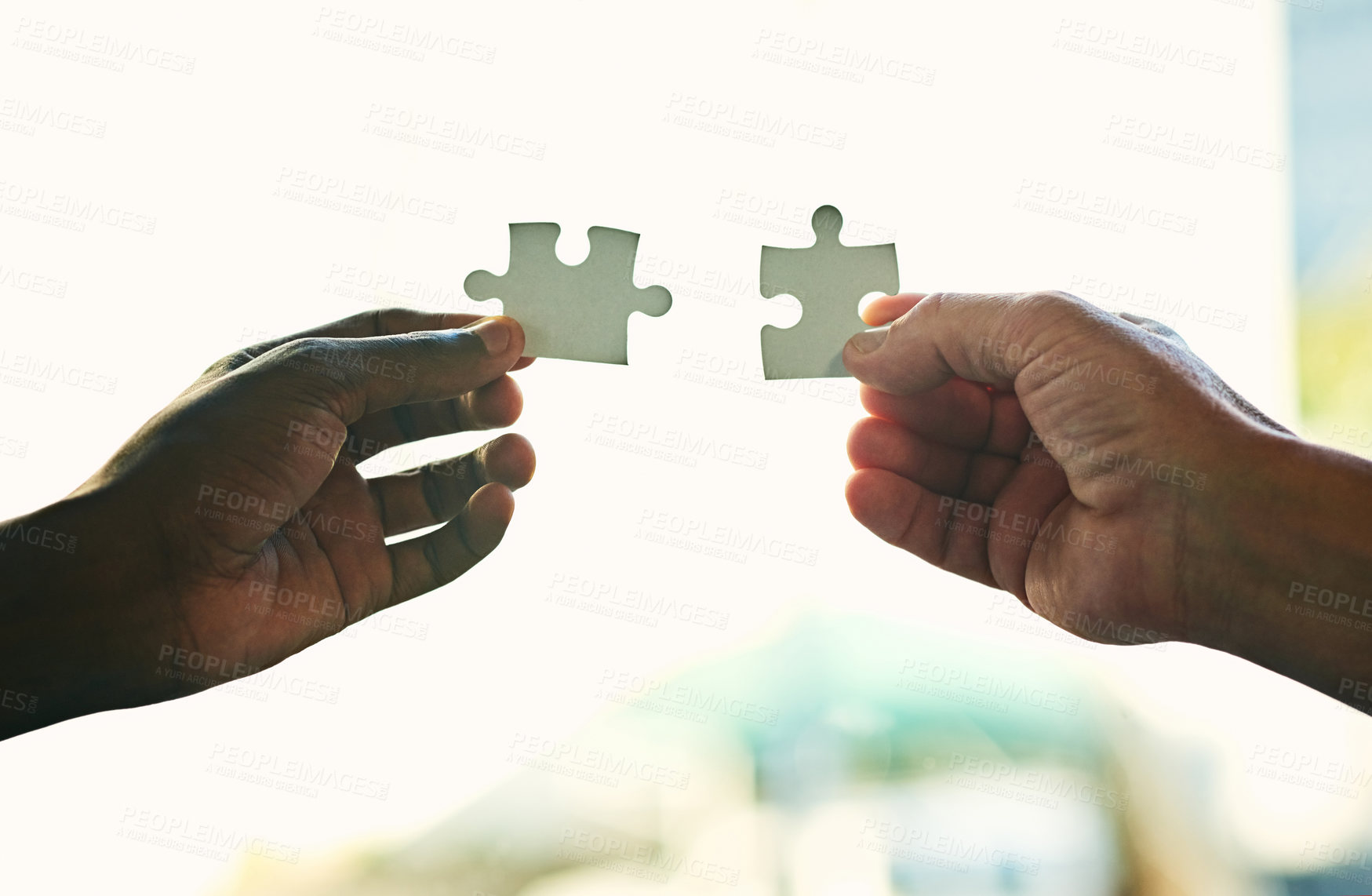 Buy stock photo Unity, synergy and teamwork with a puzzle assembly to find the perfect match or business solution. Employees put jigsaw pieces together for creative thinking team building activity.
