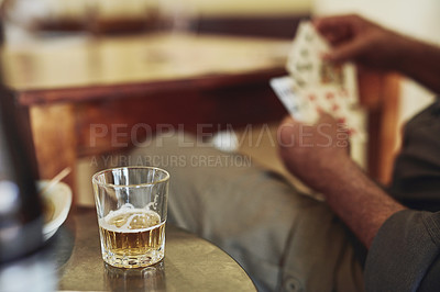 Buy stock photo Card game, drink and person hands in retirement with senior care, playing and fun on table. Cognitive, memory and activity in group with hobby, relax and poker for brain engagement and whiskey