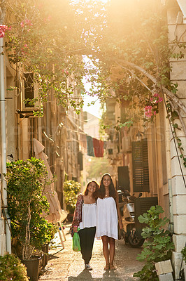 Buy stock photo Full length portrait of two young sisters travelling in a foreign city