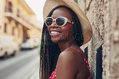 Buy stock photo Shot of a beautiful young woman spending her day out exploring a foreign city