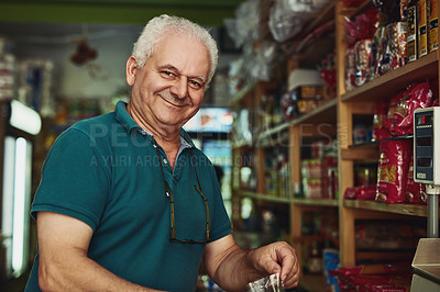 Buy stock photo Shot of a senior man working in a store