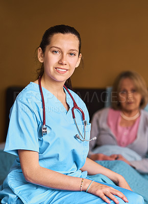 Buy stock photo Shot of a female nurse working in a retirement home